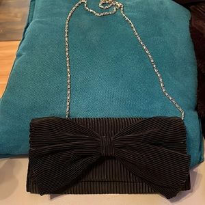 Black ribbed bow clutch with silver chain